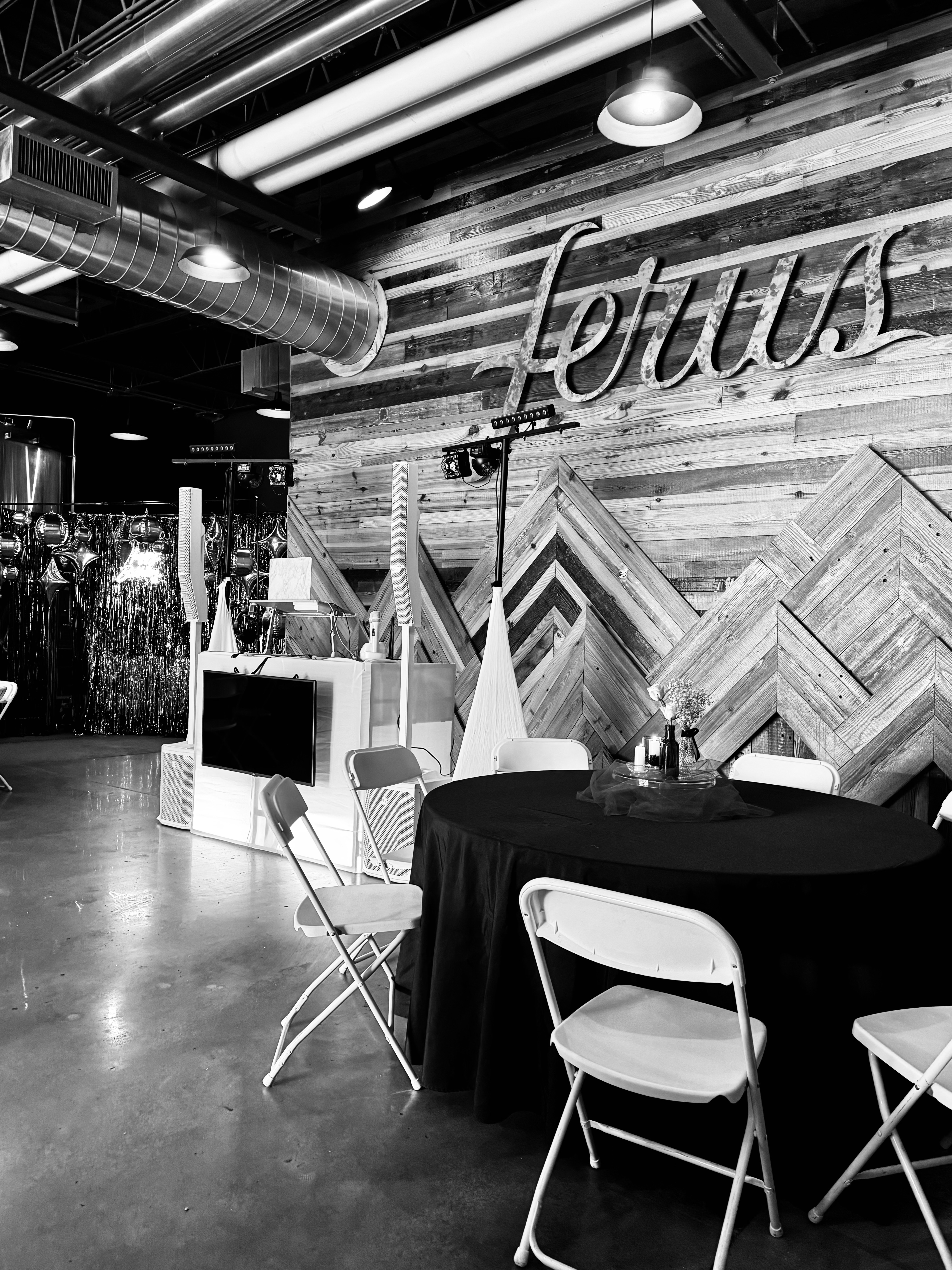 Clean corporate booth at Ferus venue with seating